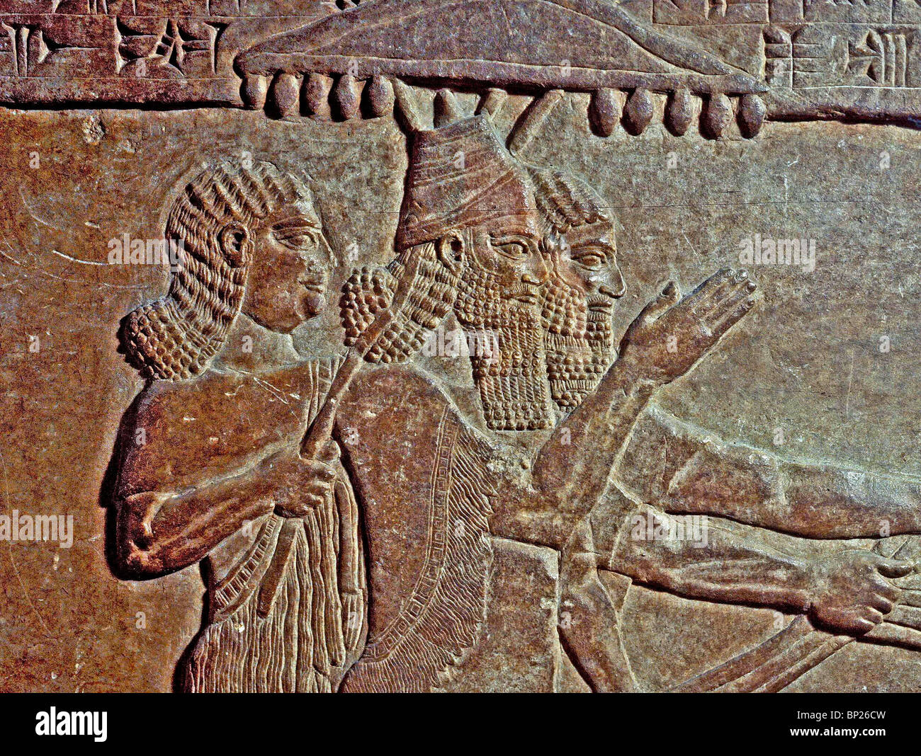 1011. KING TIGLATH PILESER IN TRIUMPH, RELIEF FROM THE ROYAL PALACE IN NIMRUD, 730 B.C. Stock Photo
