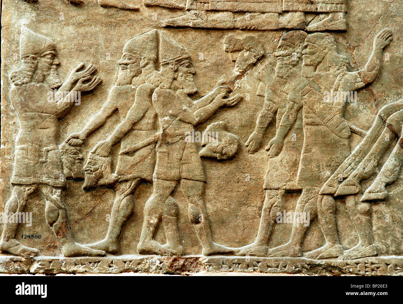 ASSYRIAN SOLDIERS PARADING PRISONERS & SHOWING HEADS OF SLAIN ENEMY SOLDIERS RELIEF FROM SANAHERIB'S PALACE AT NINVEH C. 700 Stock Photo