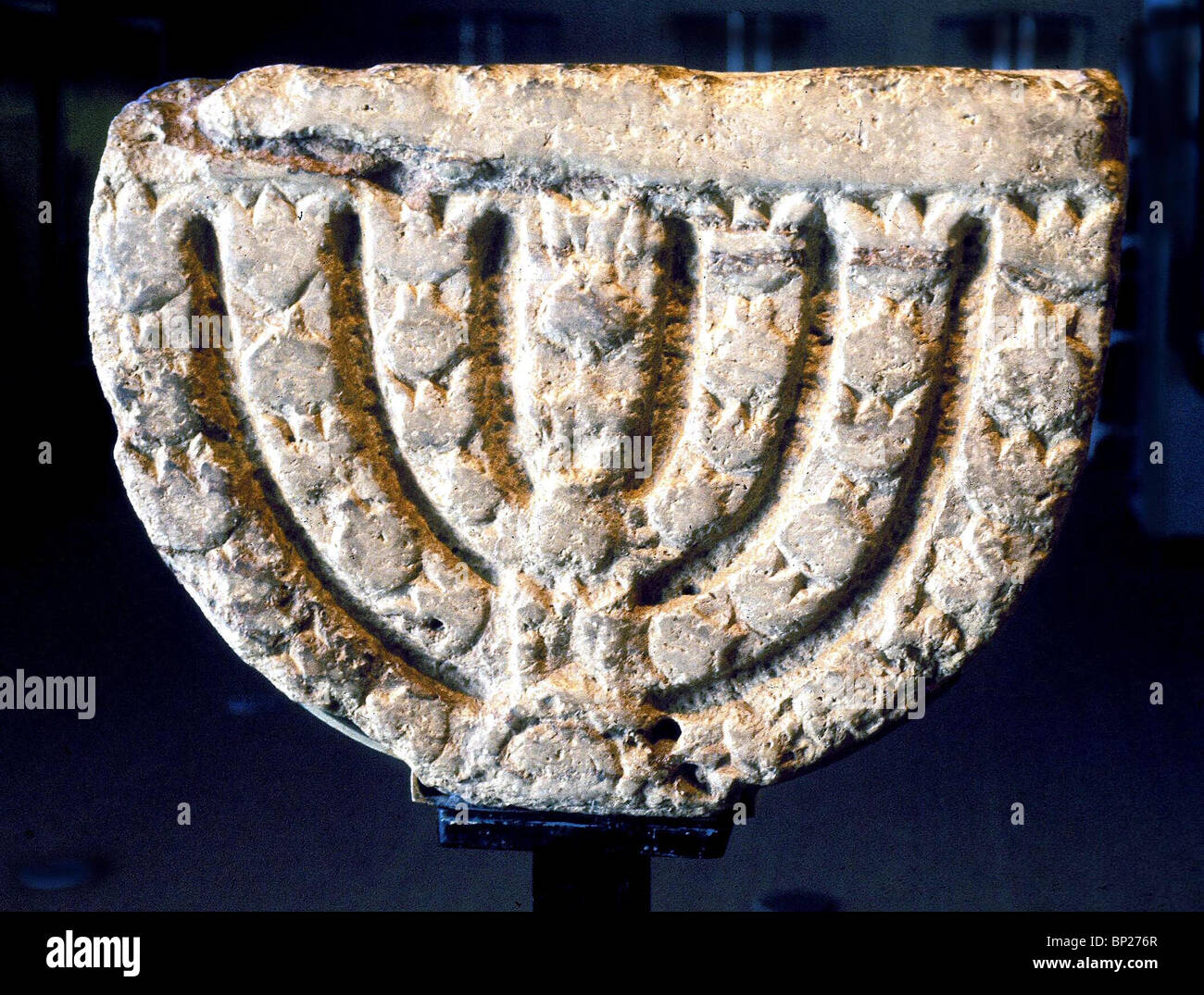 1500. HAMATH TIBERIAS SYNAGOGUE, SEVEN BRANCHED MENORAH CARVED IN LIMESTONE FROM THE 5TH. C. SYNAGOGUE Stock Photo