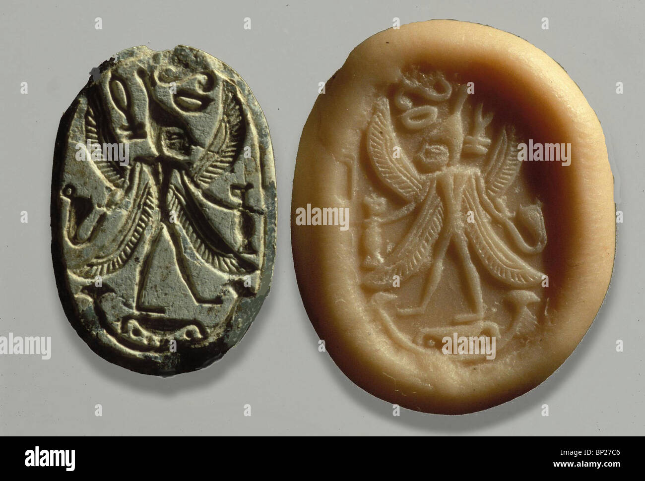 PHOENICIAN SEAL DEPICTING A WINGED CREATURE DOR EXCAVATIONS Above stood the seraphims: each one had six wings; he covered his Stock Photo