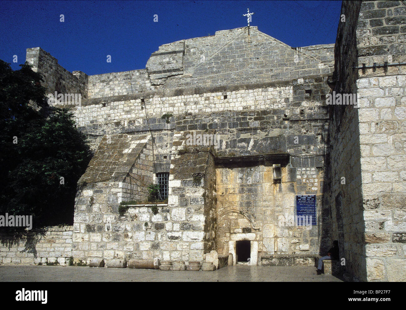 MAIN ENTRANCE TO THE BASILICA OF THE CHURCH OF NATIVITY. THERE ARE THREE GATES VISIBLE ON THIS ANCIENT (BYZANTINE) WALL: THE Stock Photo