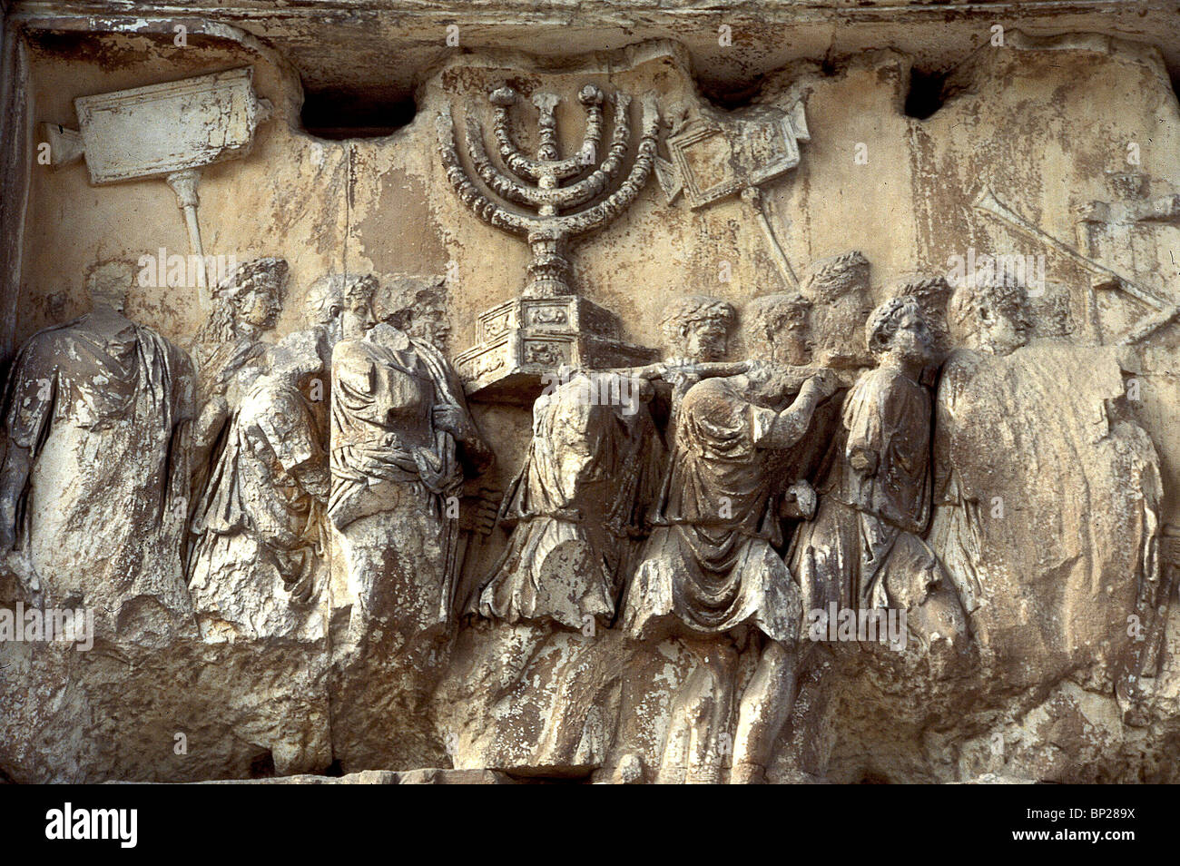 ARCH OF TITUS PANEL FROM THE ARCH DEPICTING ROMAN SOLDIERS IN TRIUMPHANT PROCESSION CARRYING THE GOLDEN MENORAH & OTHER Stock Photo