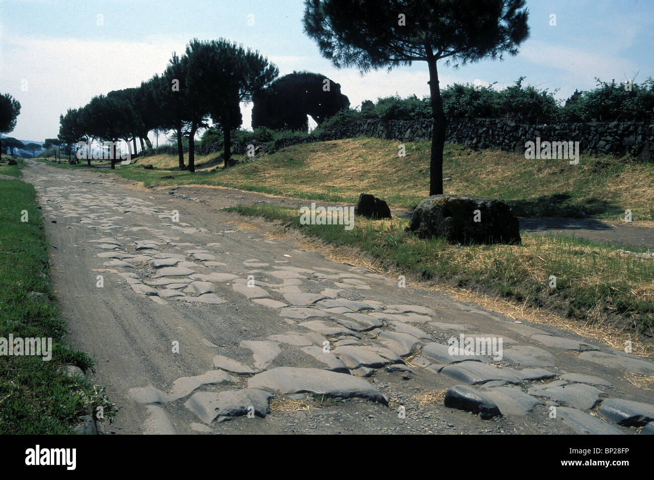 VIA APIA ANTICA ANCIENT PAVED ROMAN ROAD LEADING TO ROME BUILT IN 194 B.C. ON THIS ROAD ST. PAUL WAS LED TO PRISON IN 56 A.D. & Stock Photo