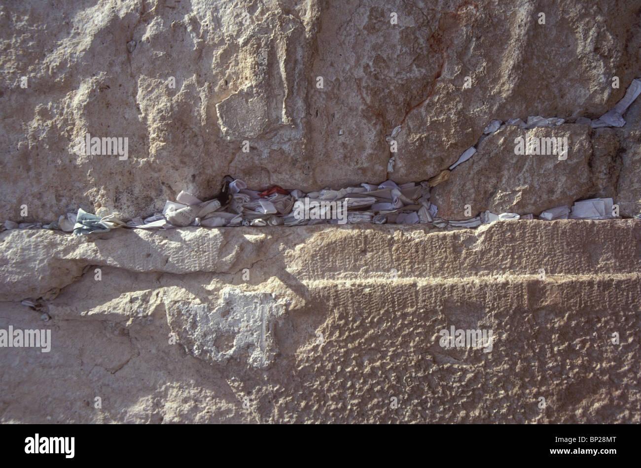 Placed between the ancient stones of the western wall hi-res stock ...