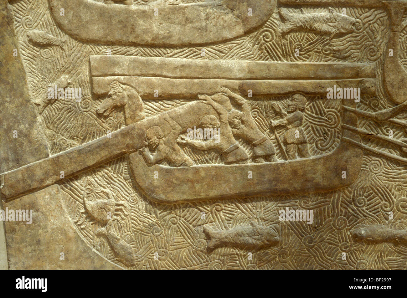 BOATS WITH HORSE-HEAD SHAPED PROW TRANSPORTING LOGS. RELIEF FROM THE PALACE OF KING SARAGON II IN KHORSABAD 721 - 705 B.C. KING Stock Photo