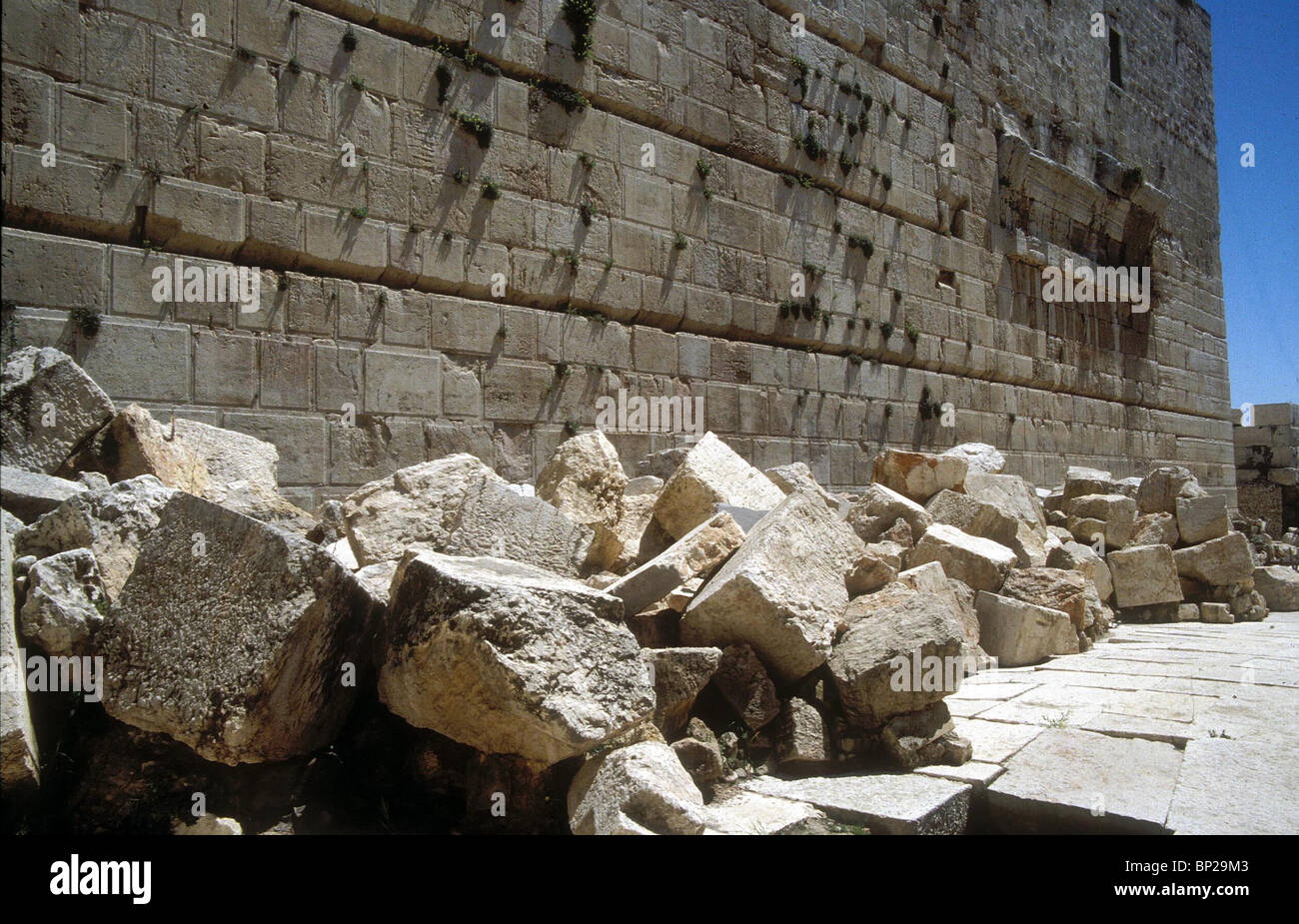 JERUSALEM - THE TEMPLE MOUNT. HUGE STONES LIE IN HEAPS ON THE ROMAN STREET NEAR ROBINSON'S ARCH. THESE CHISELLED ASHLARS FORMED Stock Photo