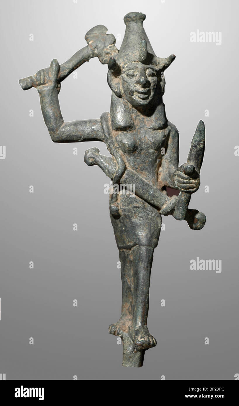 Bronze figurine of the Cnaanite war God Baal. He is armed with a sword holding a shield in his left hand & is ready to strike Stock Photo