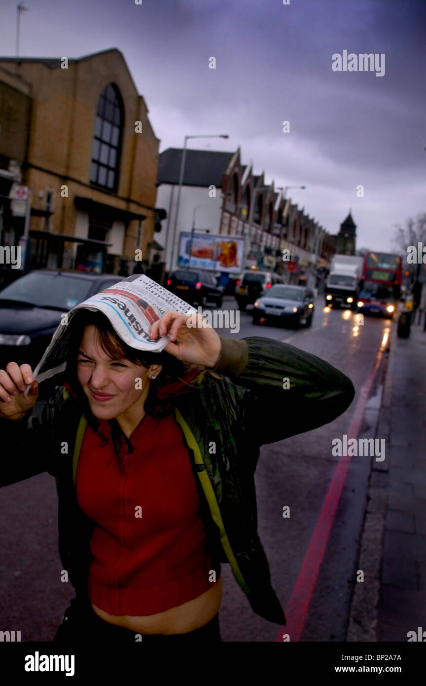 rain causes a nuisance for commuters in London, England. England is notorious for its bad weather. Stock Photo