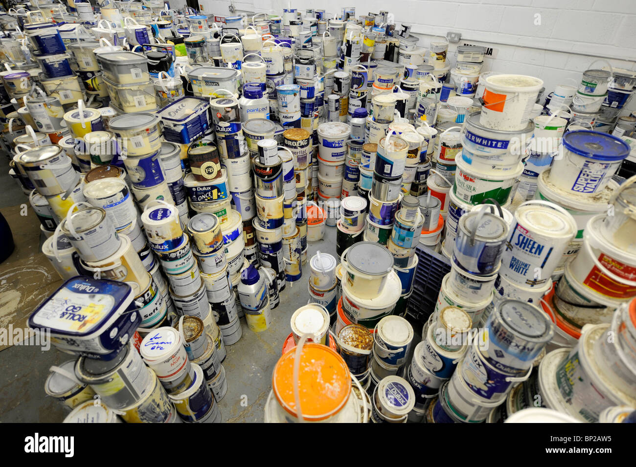 Multiple tins of paint stacked up in a Stock Photo Alamy