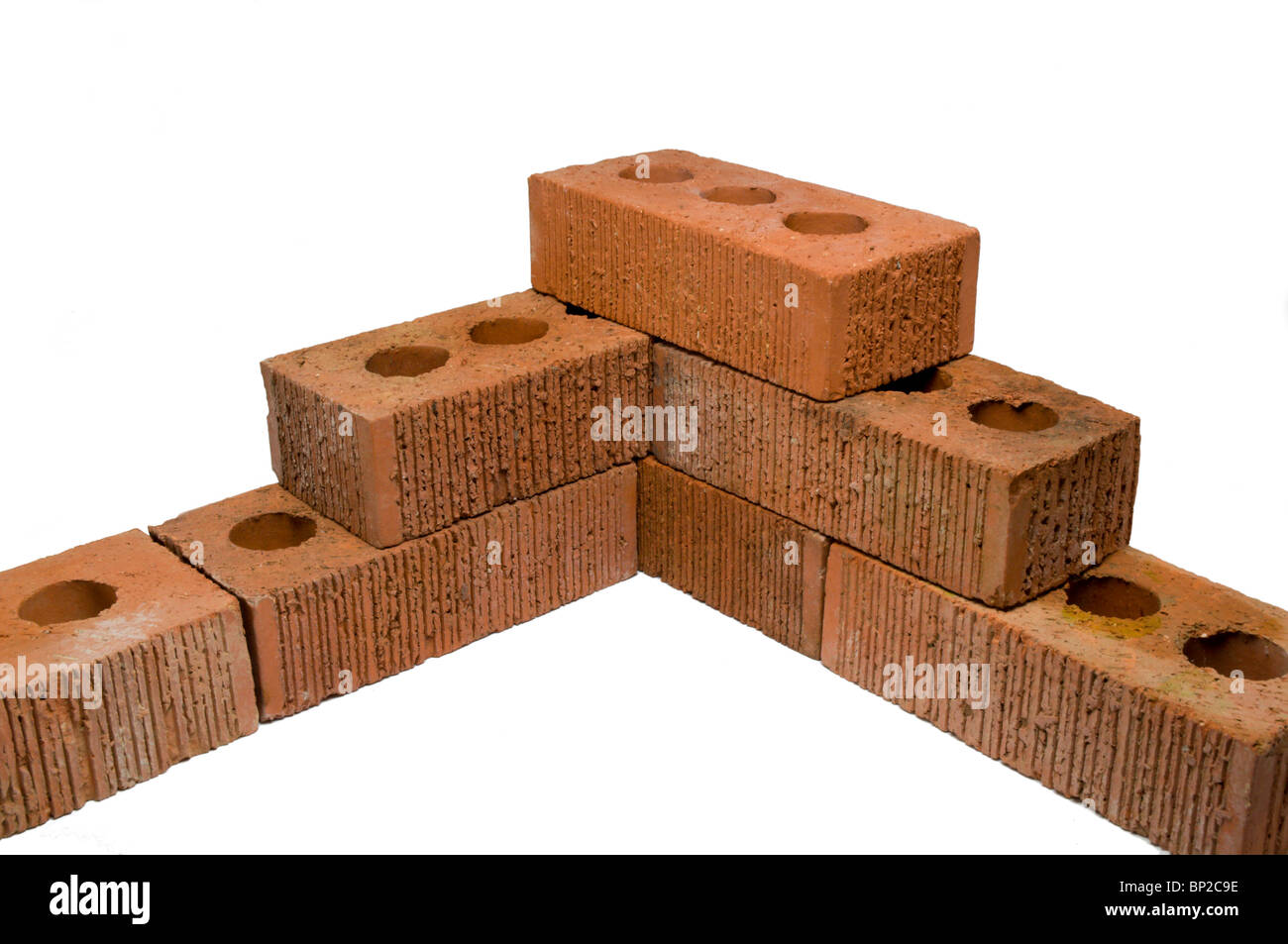 Red clay bricks on white Stock Photo