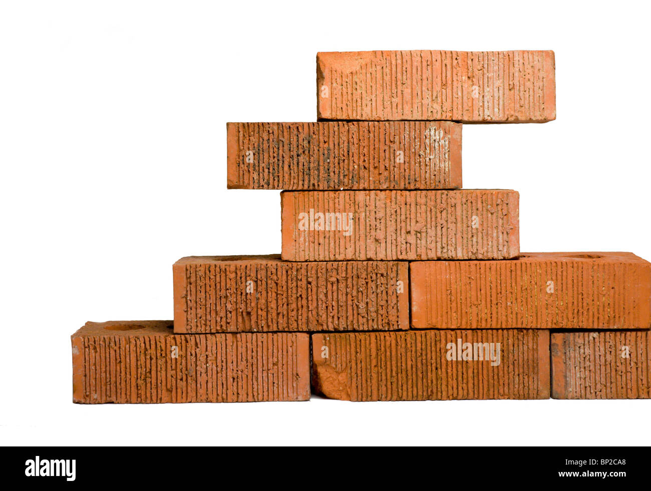 Red clay bricks on white Stock Photo