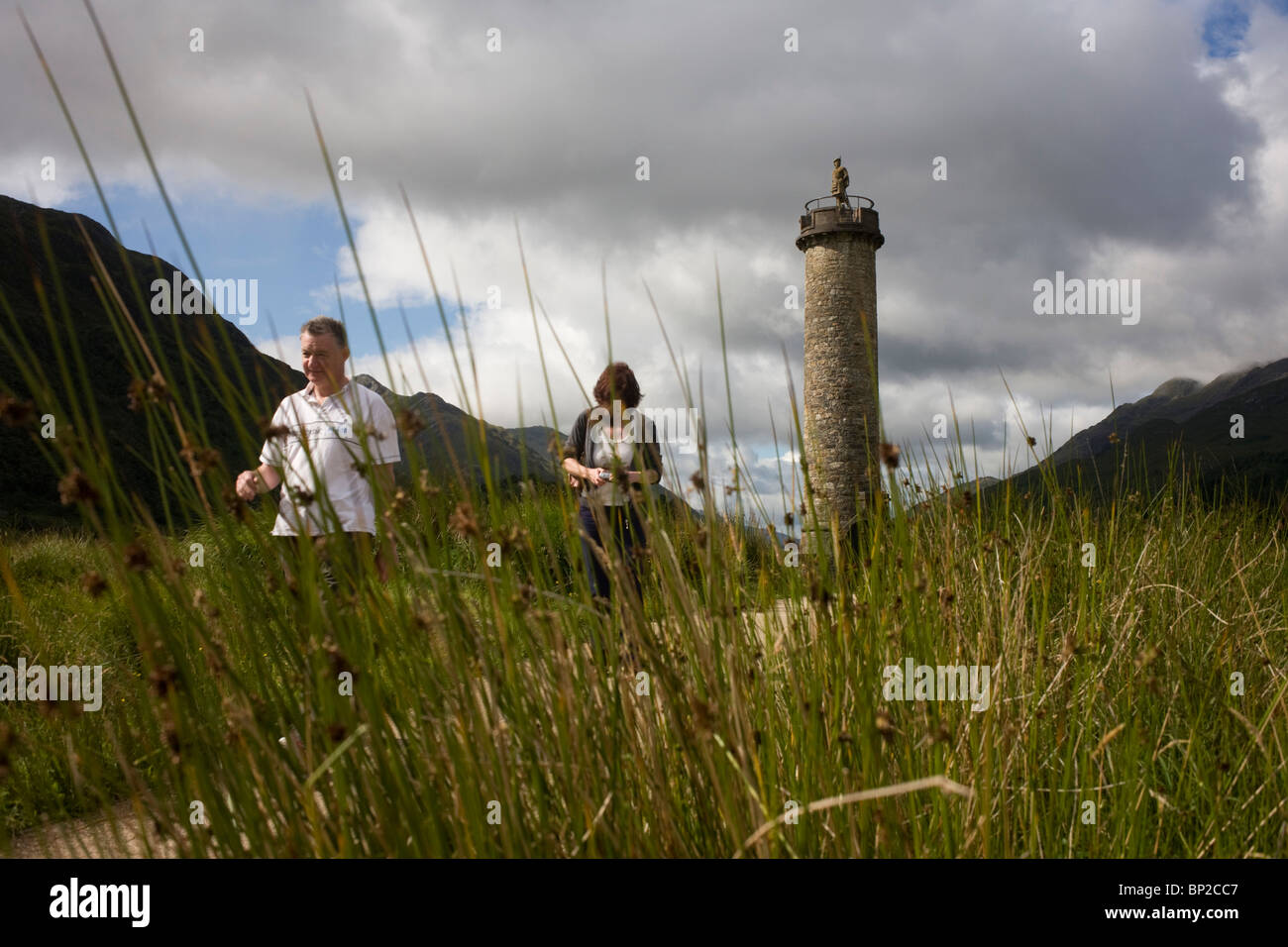 Tourists on Glenfinnan Monument built where Scottish Jacobite Bonnie Prince Charlie first raised