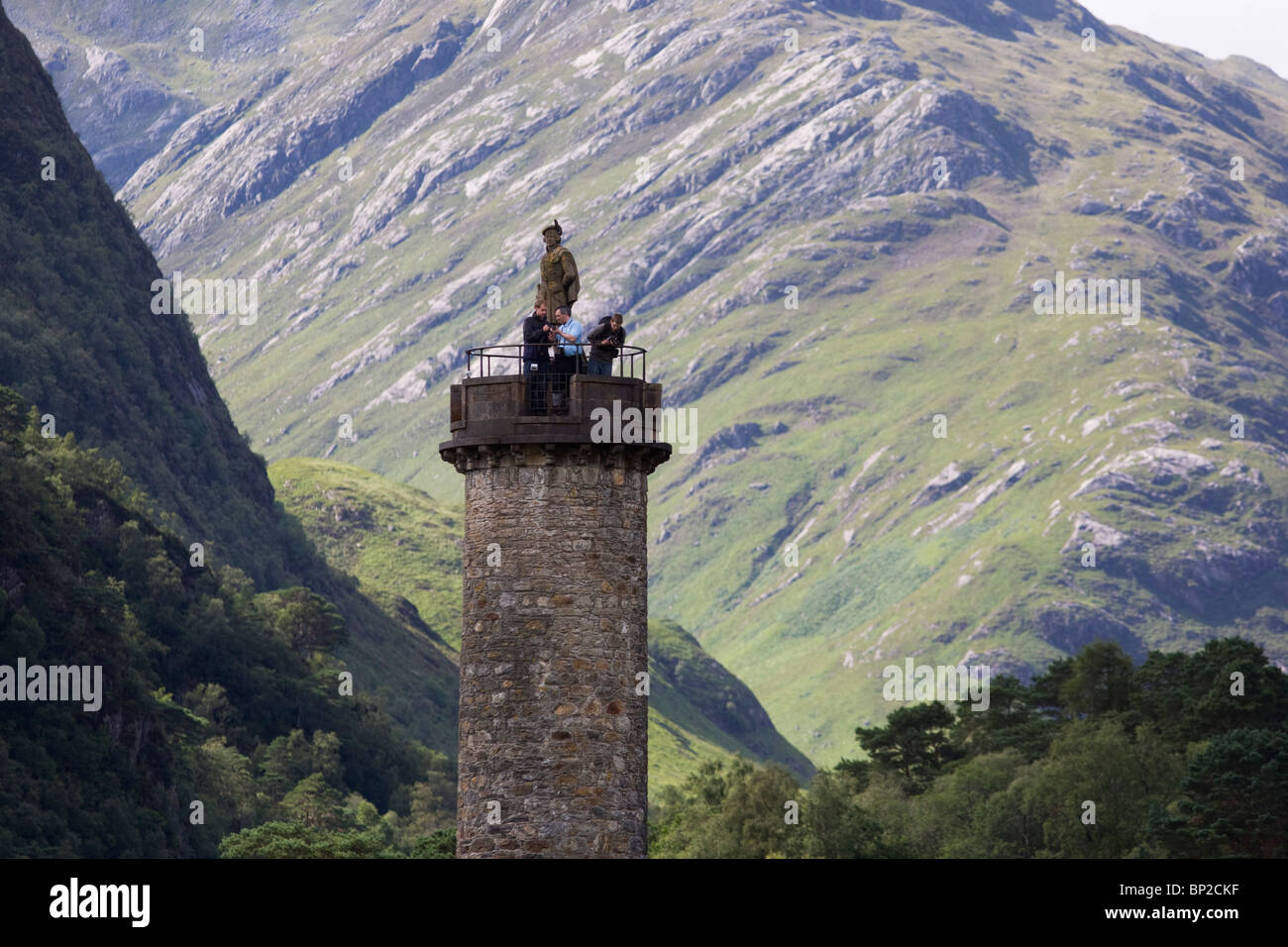 Tourists on Glenfinnan Monument built where Scottish Jacobite Bonnie Prince Charlie first raised