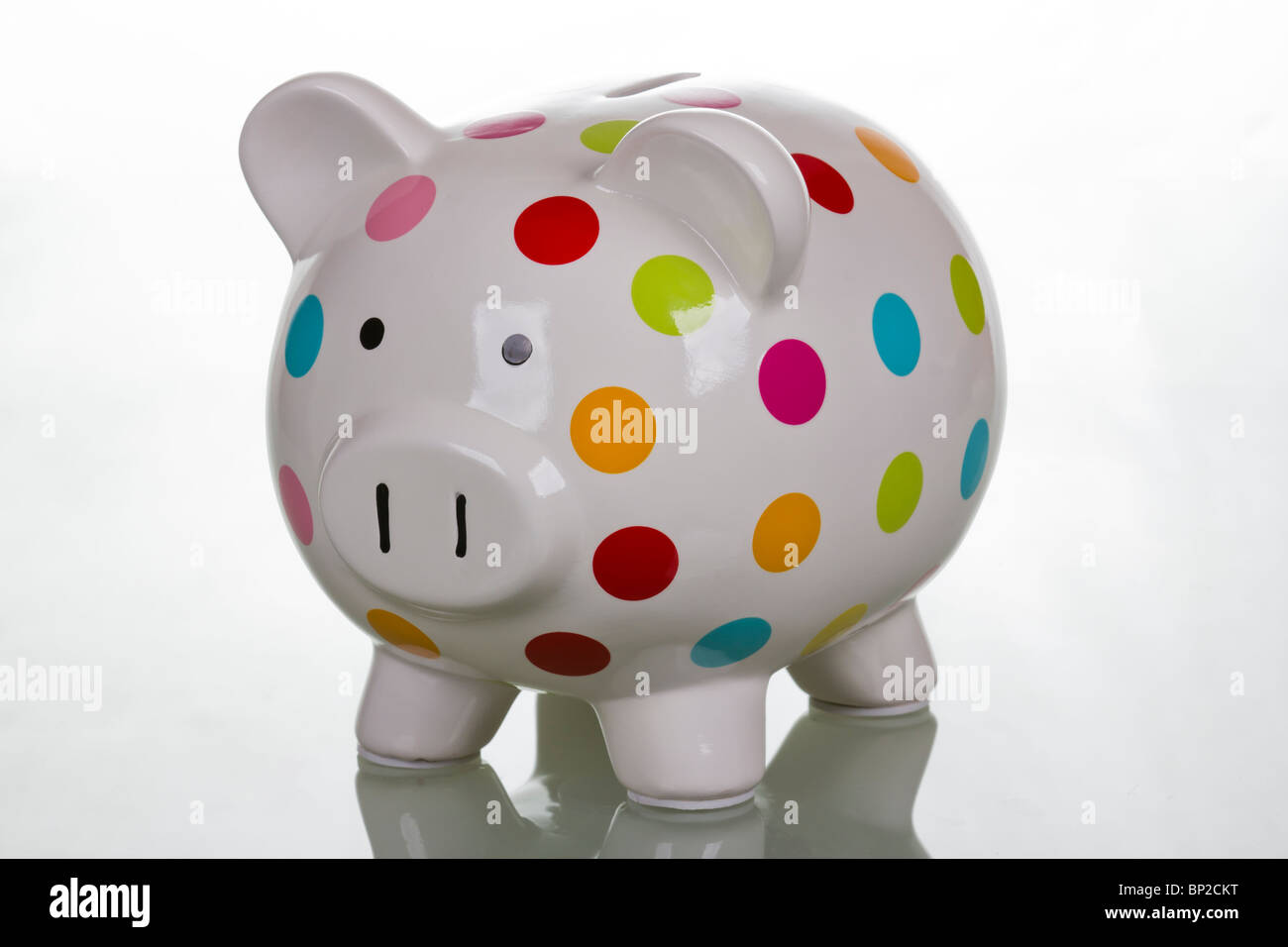 White polka dot piggy bank Stock Photo - Alamy