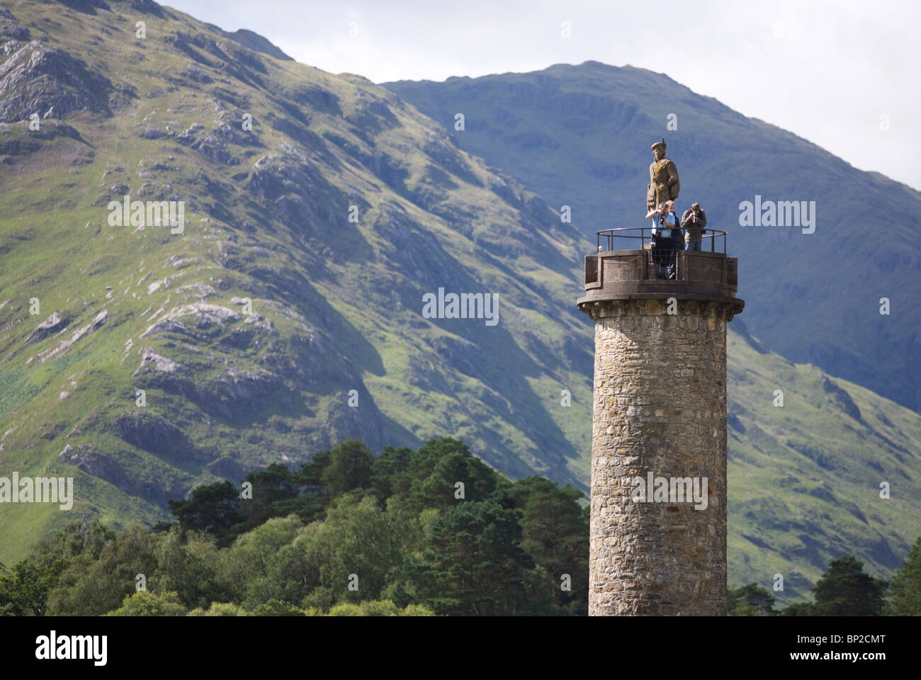 Tourists on Glenfinnan Monument built where Scottish Jacobite Bonnie Prince Charlie first raised