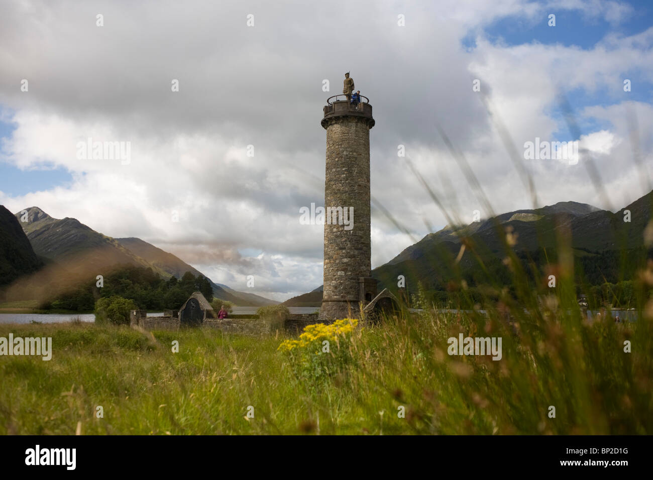 Tourists on Glenfinnan Monument built where Scottish Jacobite Bonnie Prince Charlie first raised his rebel standard in 1745. Stock Photo