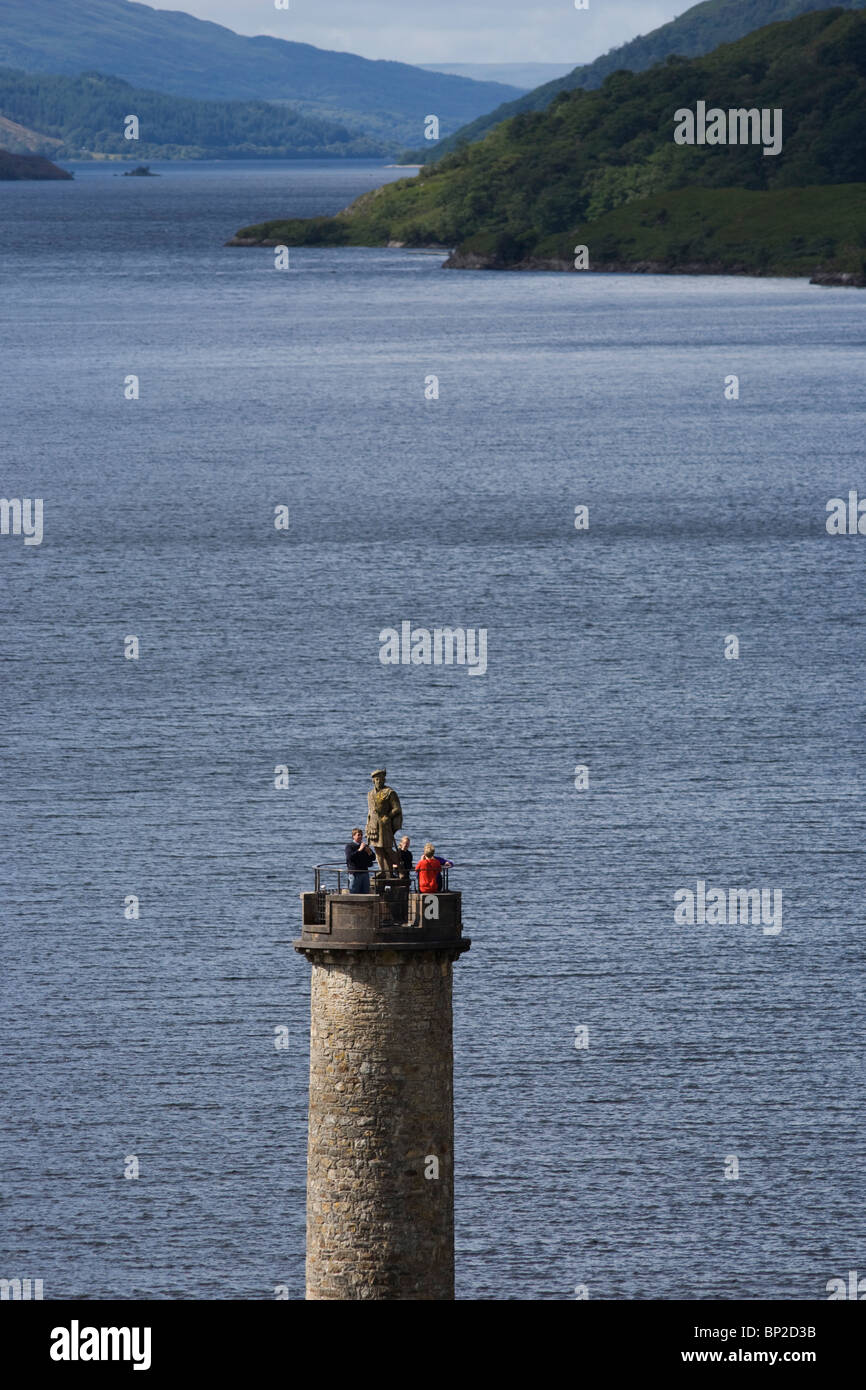 Tourists on Glenfinnan Monument built where Scottish Jacobite Bonnie Prince Charlie first raised