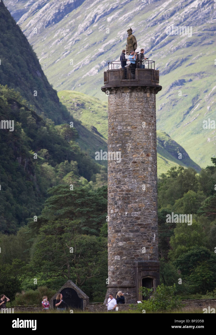 Tourists on Glenfinnan Monument built where Scottish Jacobite Bonnie Prince Charlie first raised
