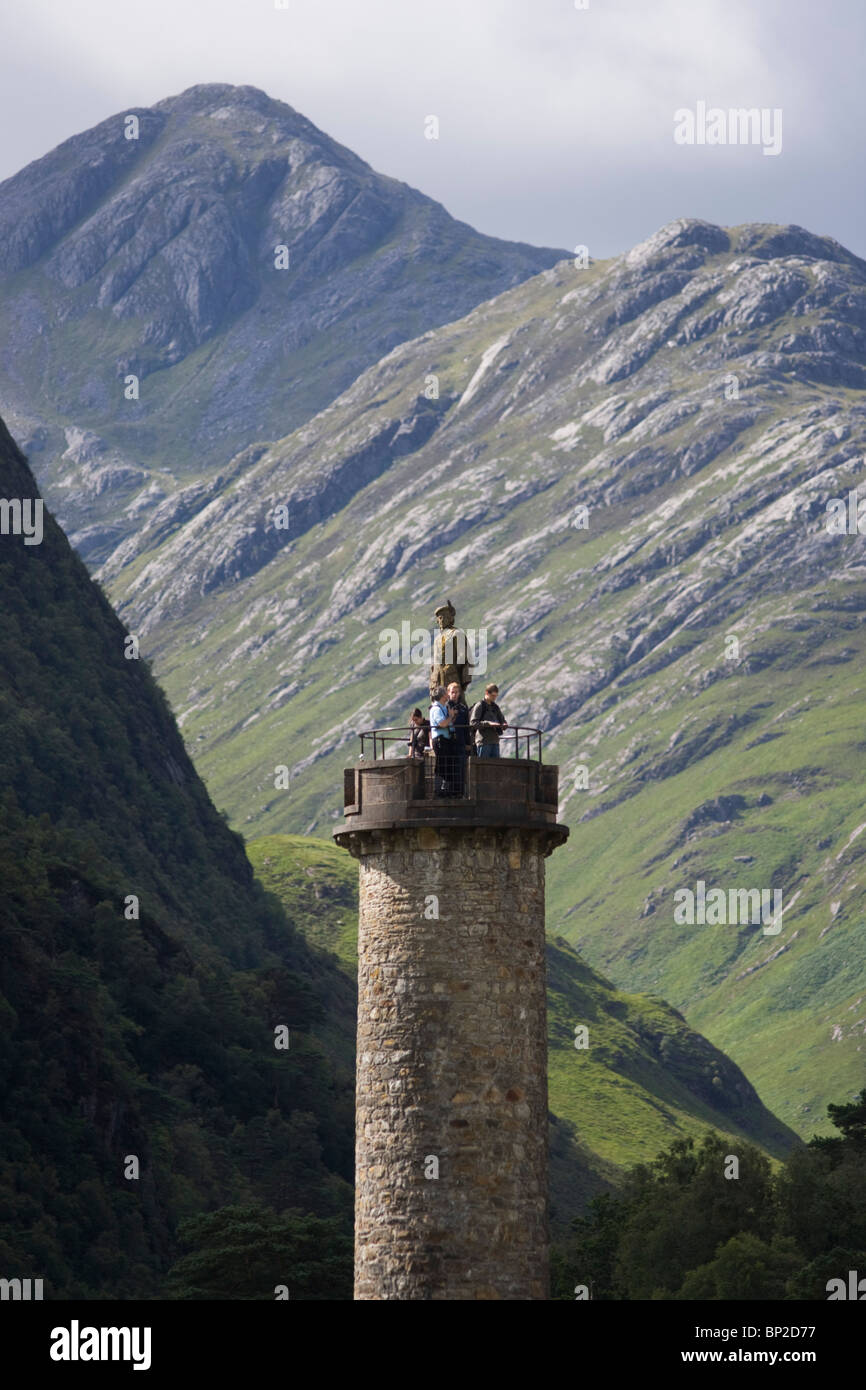 Tourists on Glenfinnan Monument built where Scottish Jacobite Bonnie Prince Charlie first raised