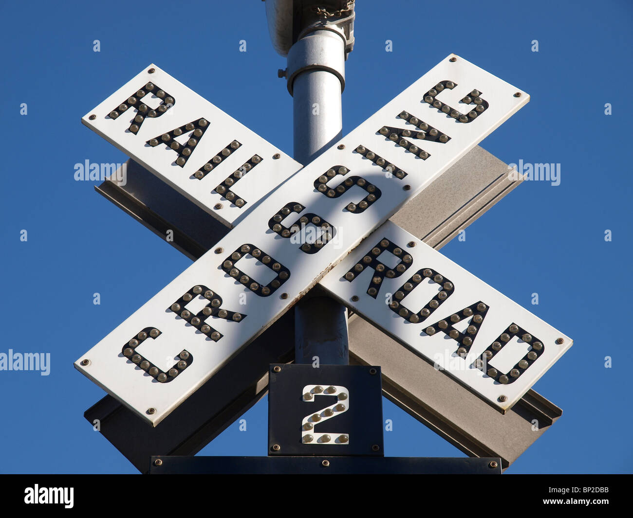 Old fashion Railroad Crossing warning sign. Stock Photo