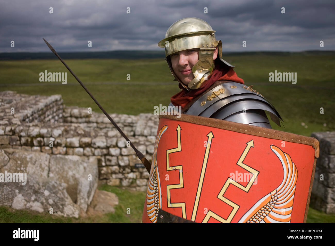 Re-enactment soldier at Housesteads Fort on Roman Hadrian's Wall, once the northern frontier of Rome's empire. Stock Photo