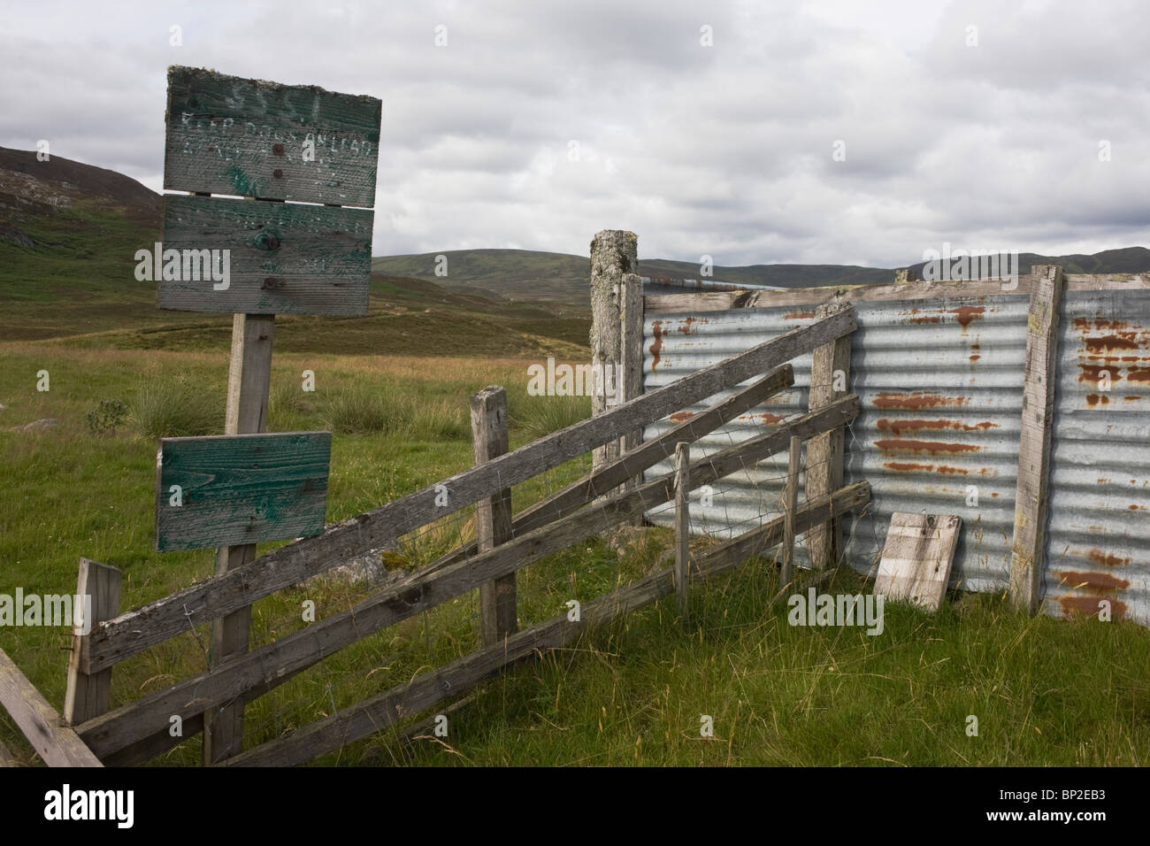 Rusted corrugated iron in abandoned livestock farm pens in Glen Bauchor, Newtonmore, Scotland. Stock Photo