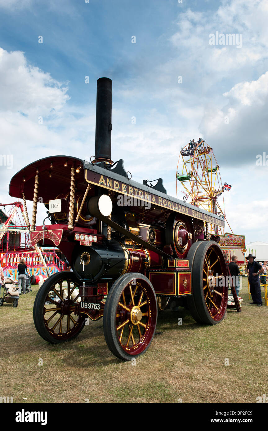 Fowler Showmans Traction Engine 'Lion' powering steam fair rides at a steam fair in England Stock Photo
