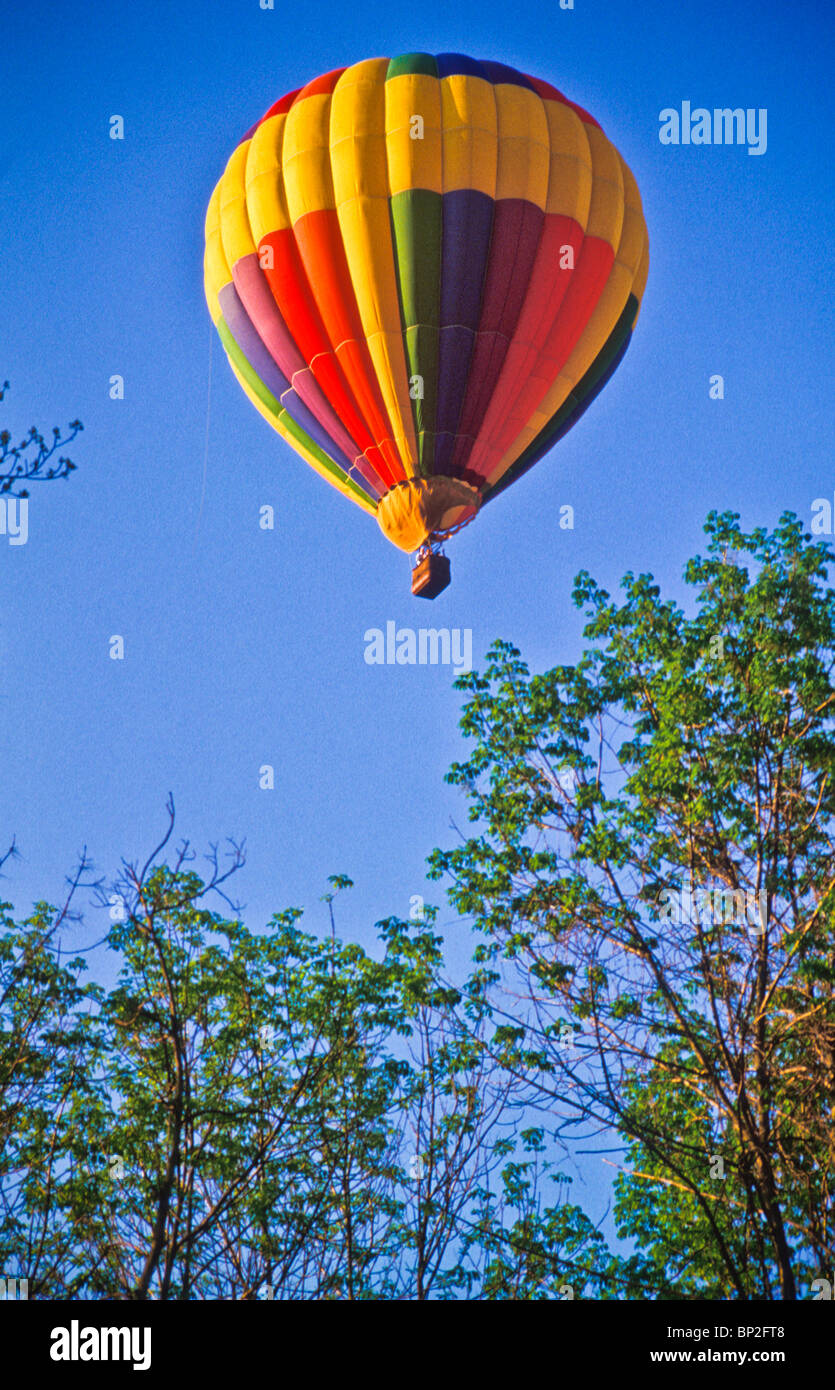 Hot air balloon riders soar , float over Lancaster farm fields Stock Photo