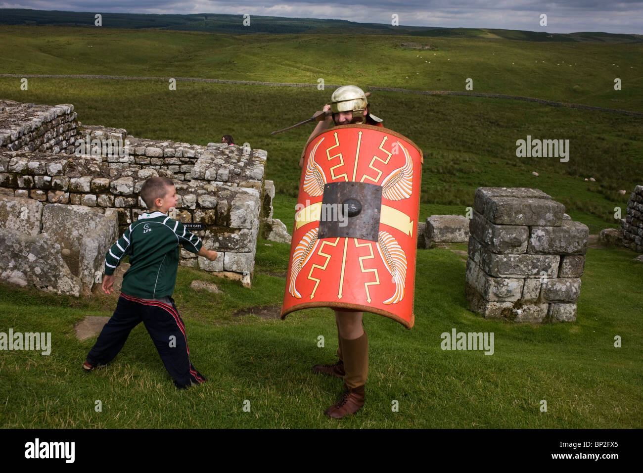 Re-enactment soldier at Housesteads Fort on Roman Hadrian's Wall, once the northern frontier of Rome's empire. Stock Photo