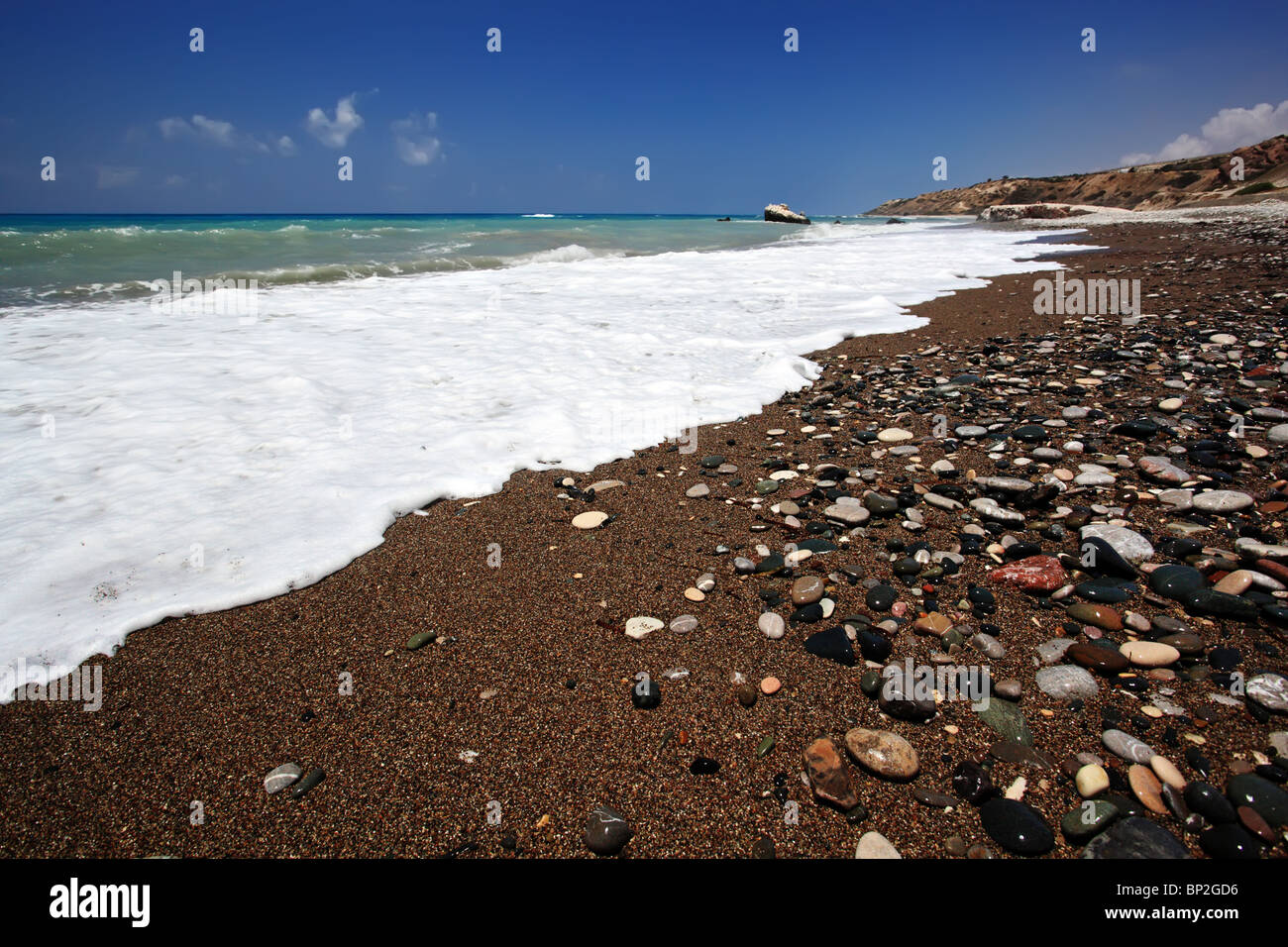 Summer beach. Surf, sand and stones. Mediterranean, Cyprus. Stock Photo