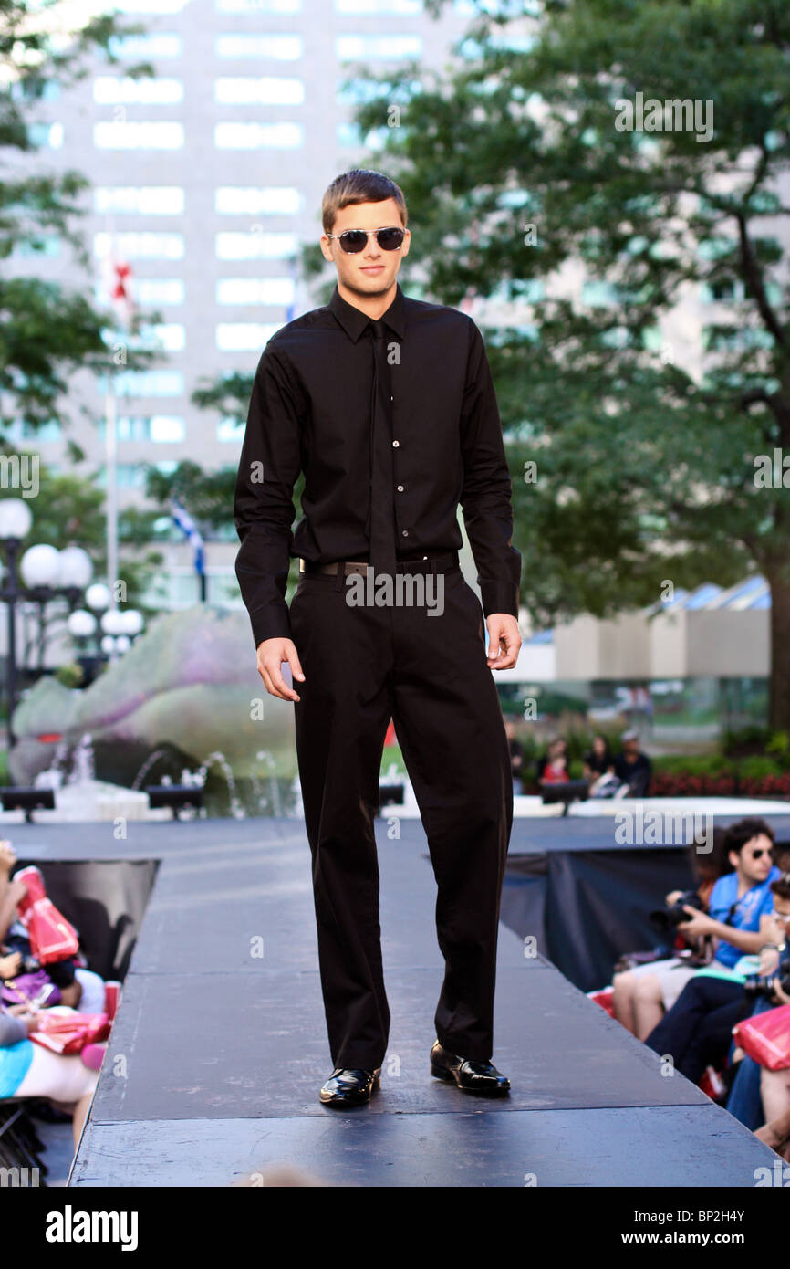 male model black shirt pants outdoor catwalk Stock Photo Alamy