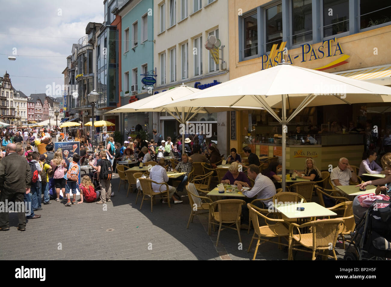 Trier Germany Europe EU Busy open air cafes in the centre of this oldest city in Germany Stock Photo