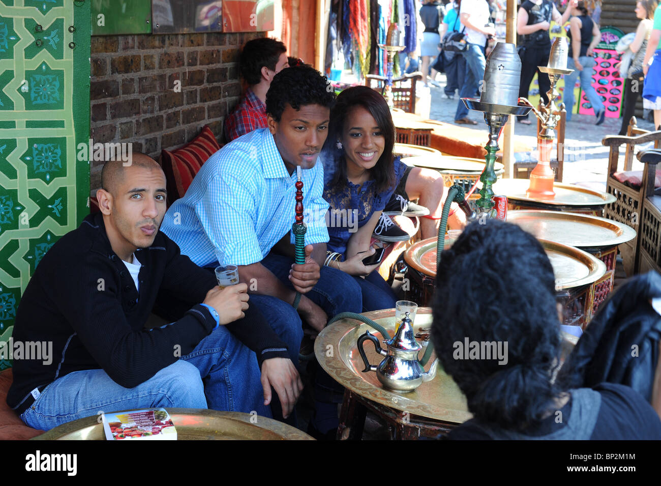 Hookah smokers in cafe in Camden Market, London Stock Photo Alamy