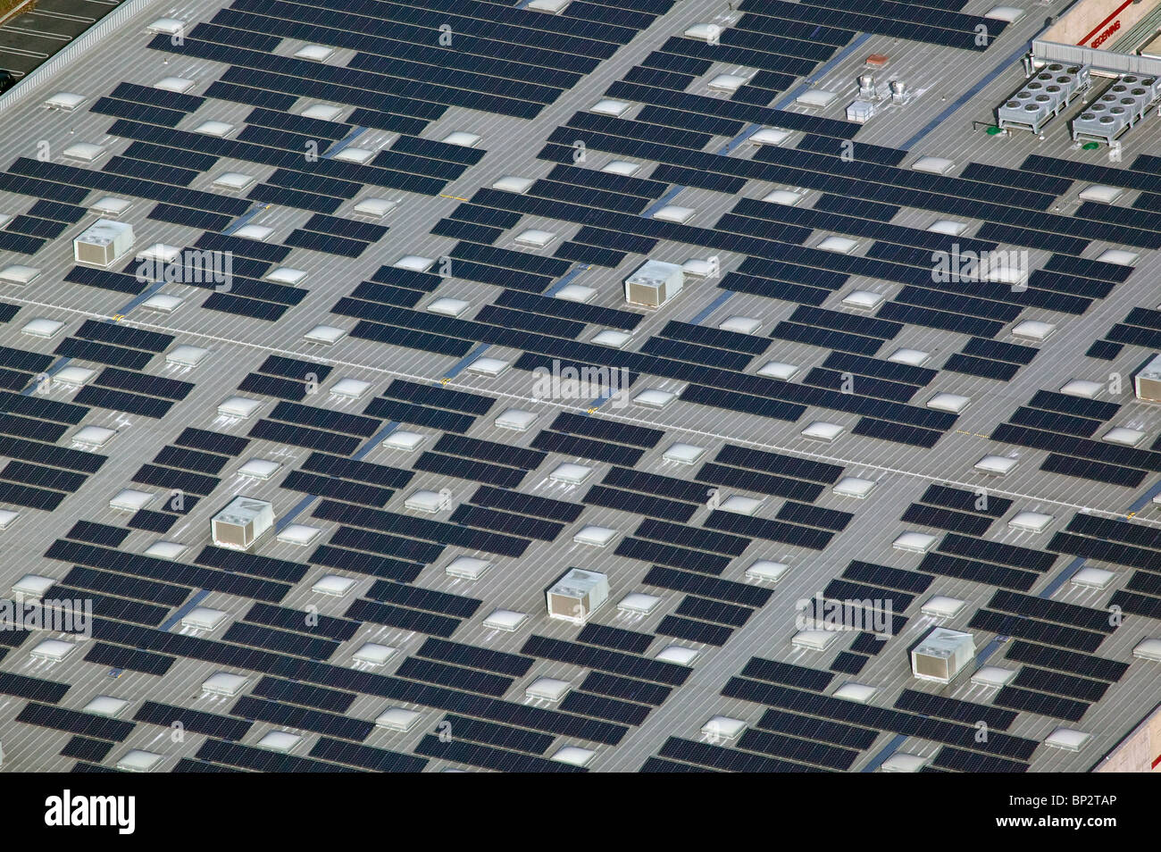 aerial view above solar power panels Costco warehouse rooftop Richmond California Stock Photo