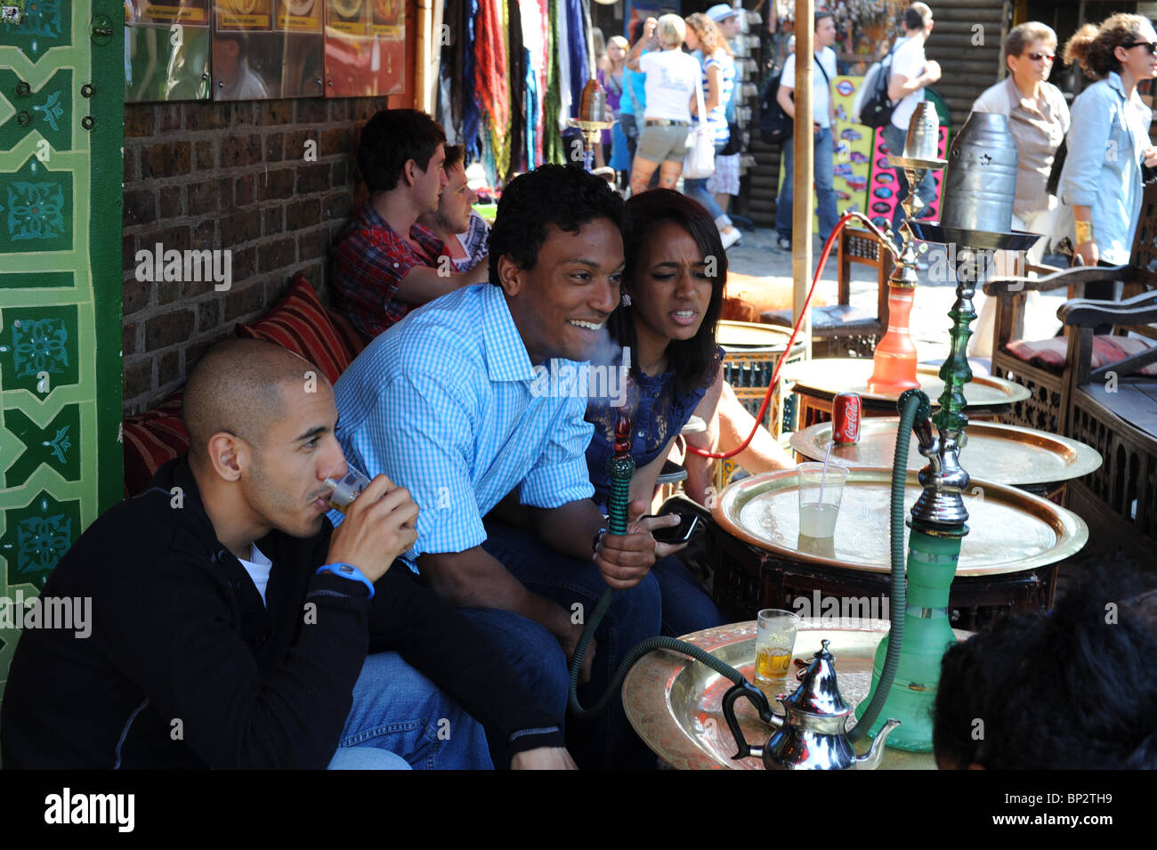 Hookah smokers in cafe in Camden Market, London Stock Photo Alamy