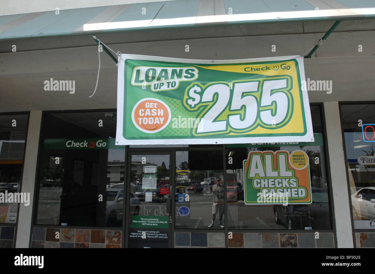 A Check & Go store in Orange, CA offers payday loans and other high-interest financial service targeting low income people. Stock Photo