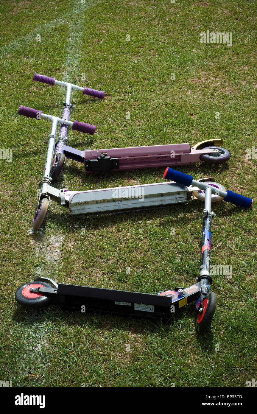 Folding Scooters,micro scooters,Best Friend Best Friends,Folding Scooters,white ethnicity|,close, unite,closeness,unity, Stock Photo