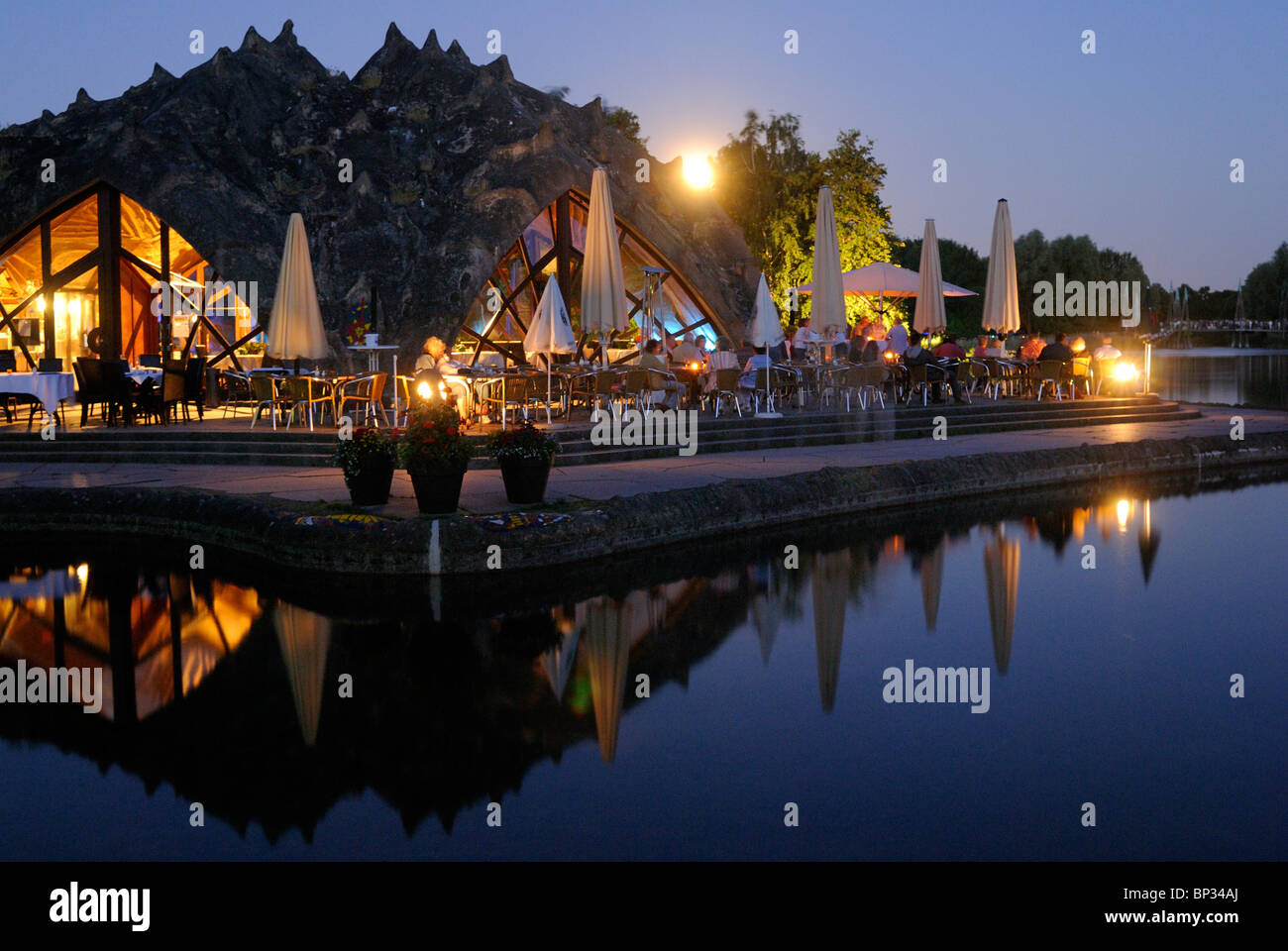 Café by the lake, BUGA Park, Britzer Garten, Bundesgartenschau Park, midsummer night, moon, Britz, Neukoelln, Berlin, Germany. Stock Photo