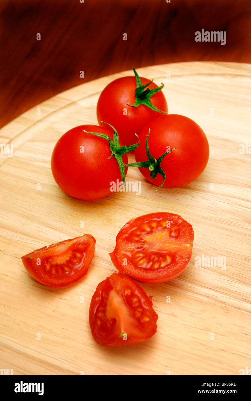 cherry tomatoes on a cutting board Stock Photo - Alamy