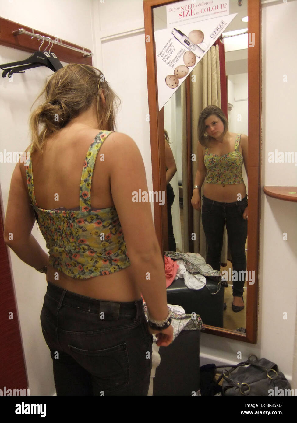 teenage girl trying on clothes in changing room Stock Photo - Alamy