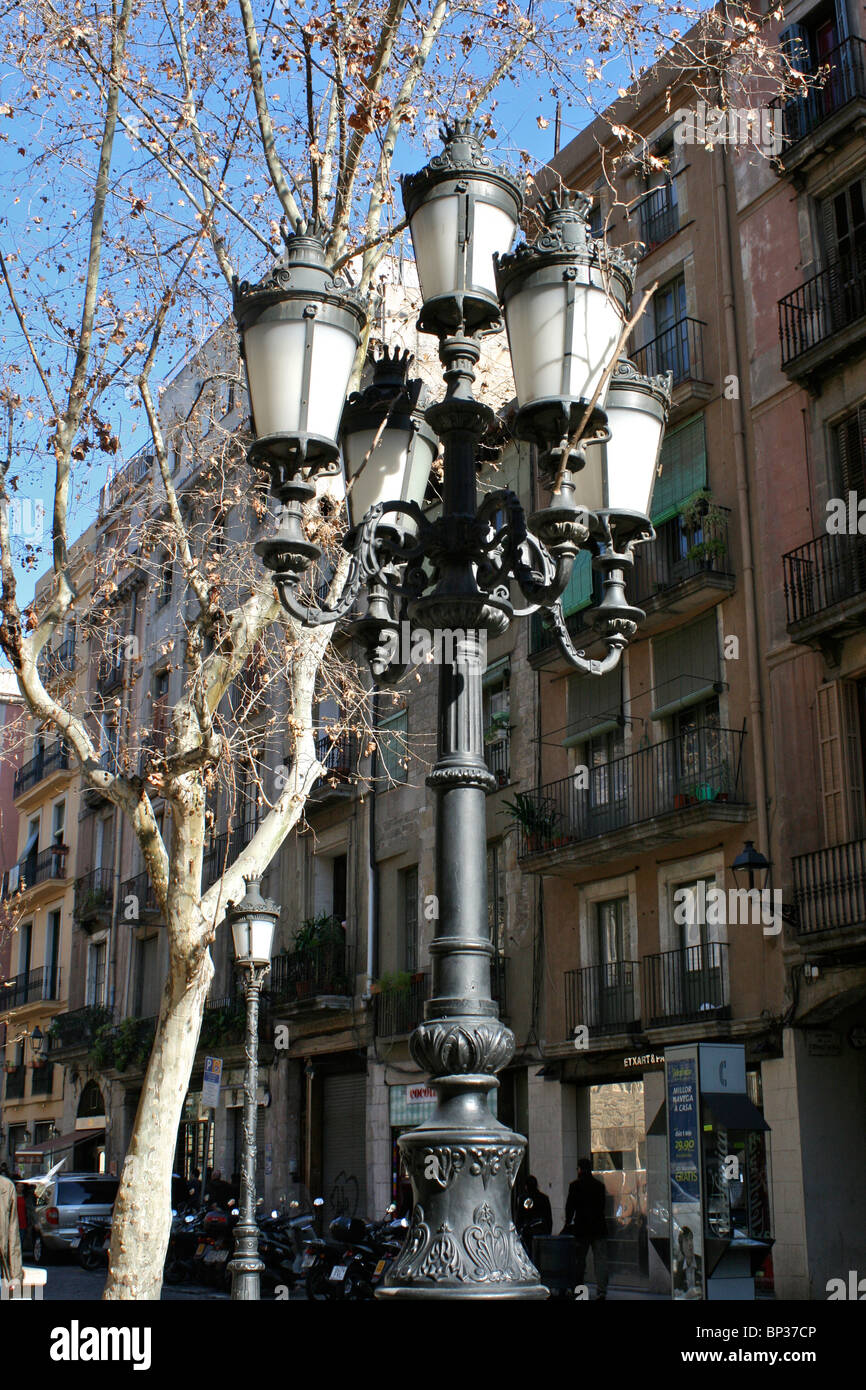 Ornate wrought iron street lamps with 6 lights, with tenement houses