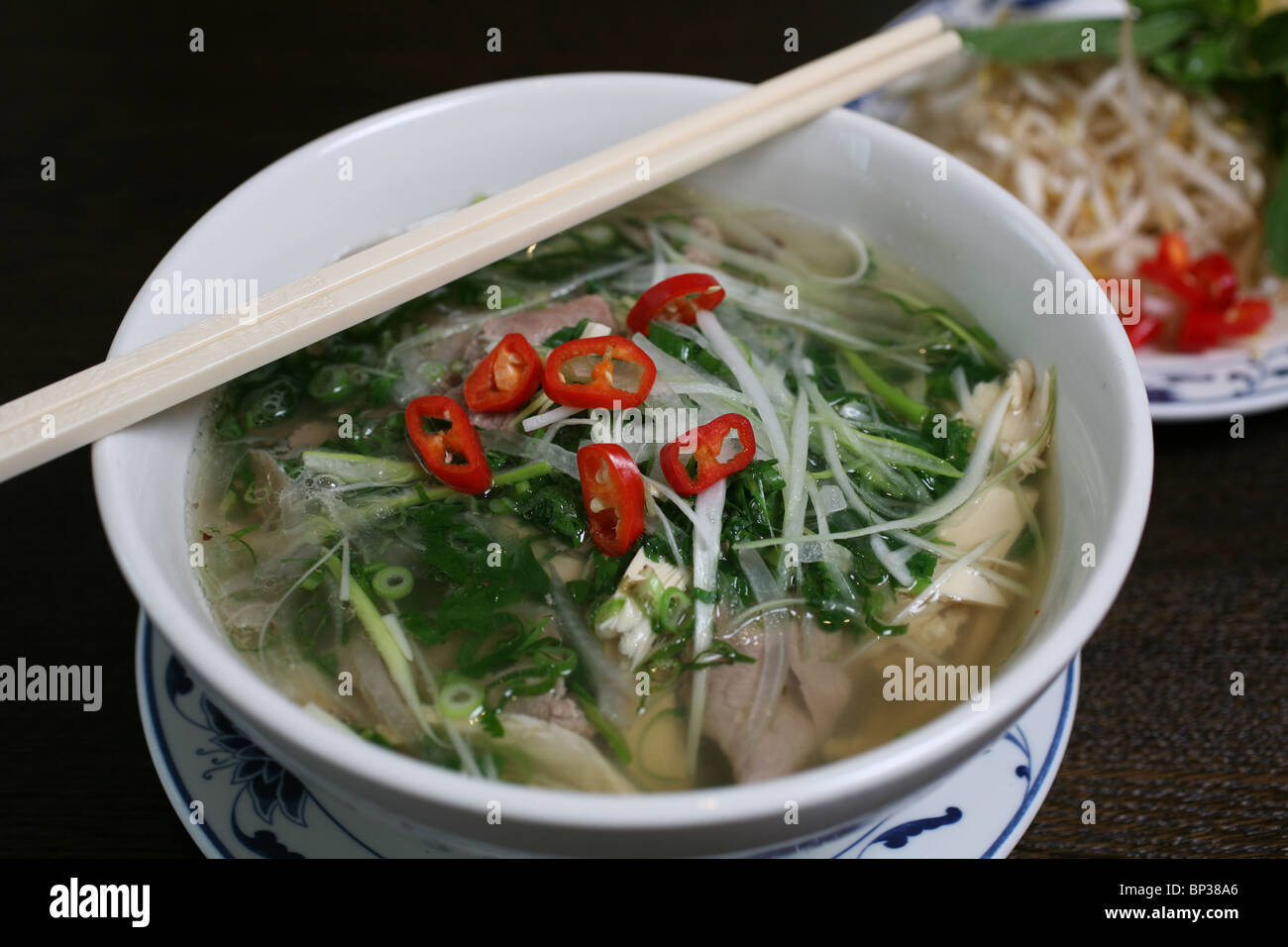 Vietnamese Chicken Pho, Noodle Soup, cooked at Viet Grill, Shoreditch, London, UK. PhotoJeff