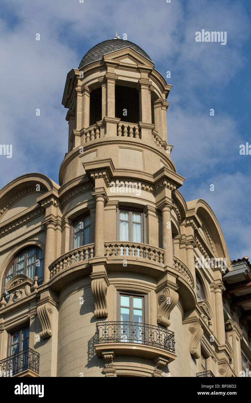 Ornate tower and balconied windows on a building being converted into a hotel, on Via Laietana in Barcelona Stock Photo
