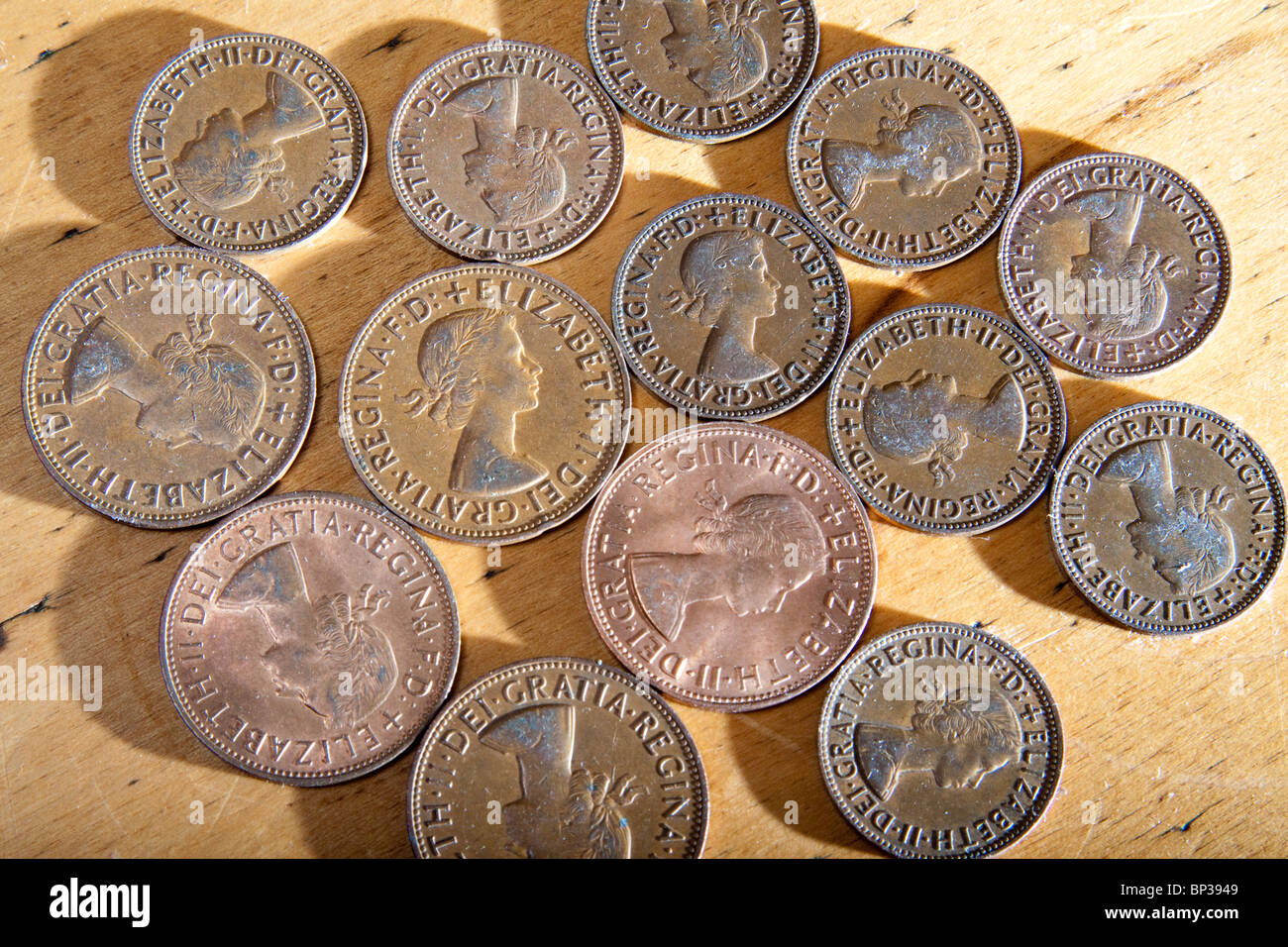 Pattern of young Queen Elizabeth II copper coins face up. Stock Photo