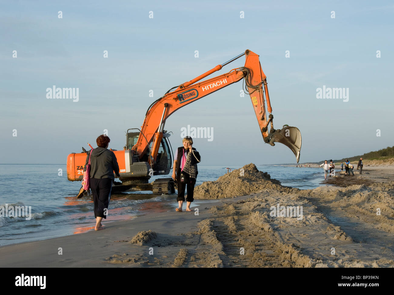 Excavator digging sand on beach hi-res stock photography and images - Alamy
