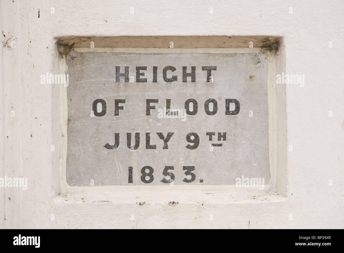 Plaque set in wall showing height of flood 9th July 1853 in town of Brecon Powys Wales UK Stock Photo