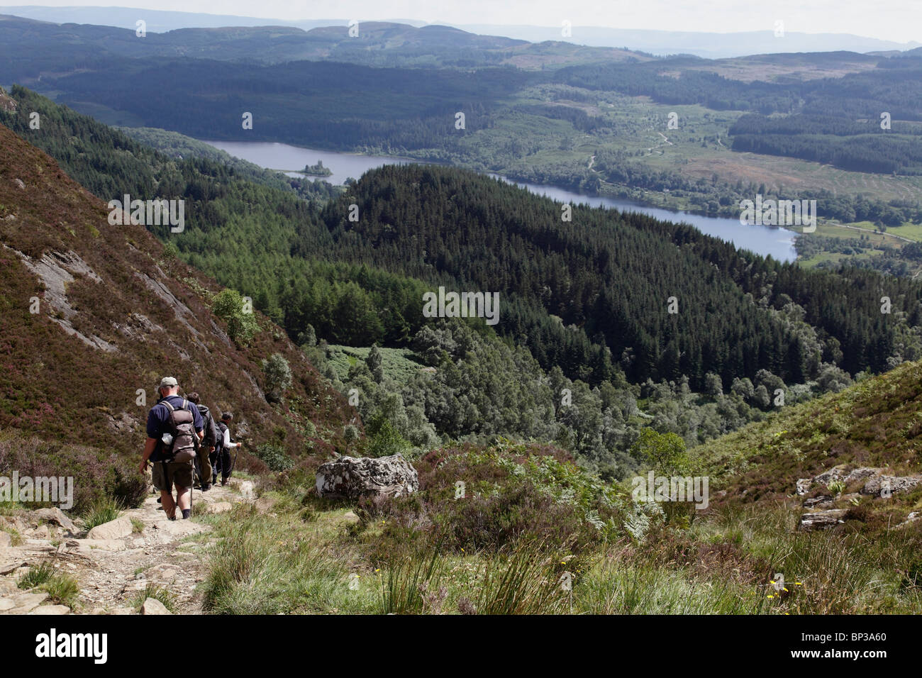 A group of hillwalkers descending from the summit  of Ben A'an in the Trossachs, Scotland, UK Stock Photo