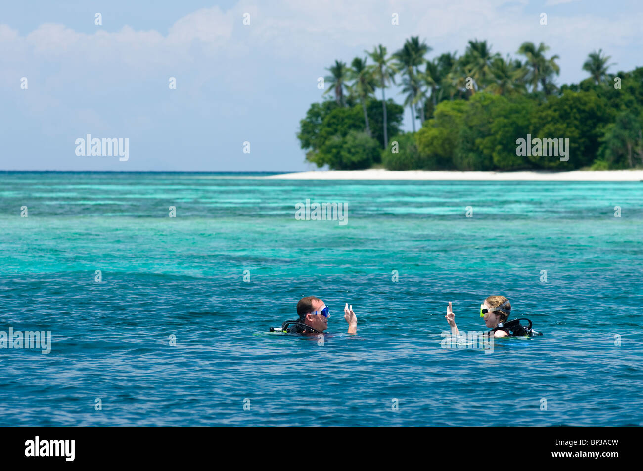Couple surfacing after dive, Pom Pom Island Resort, Celebes Sea, Sabah,  East Malaysia Stock Photo - Alamy