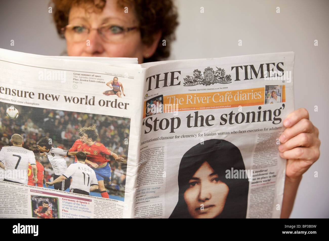 Woman reading The Times newspaper Stock Photo