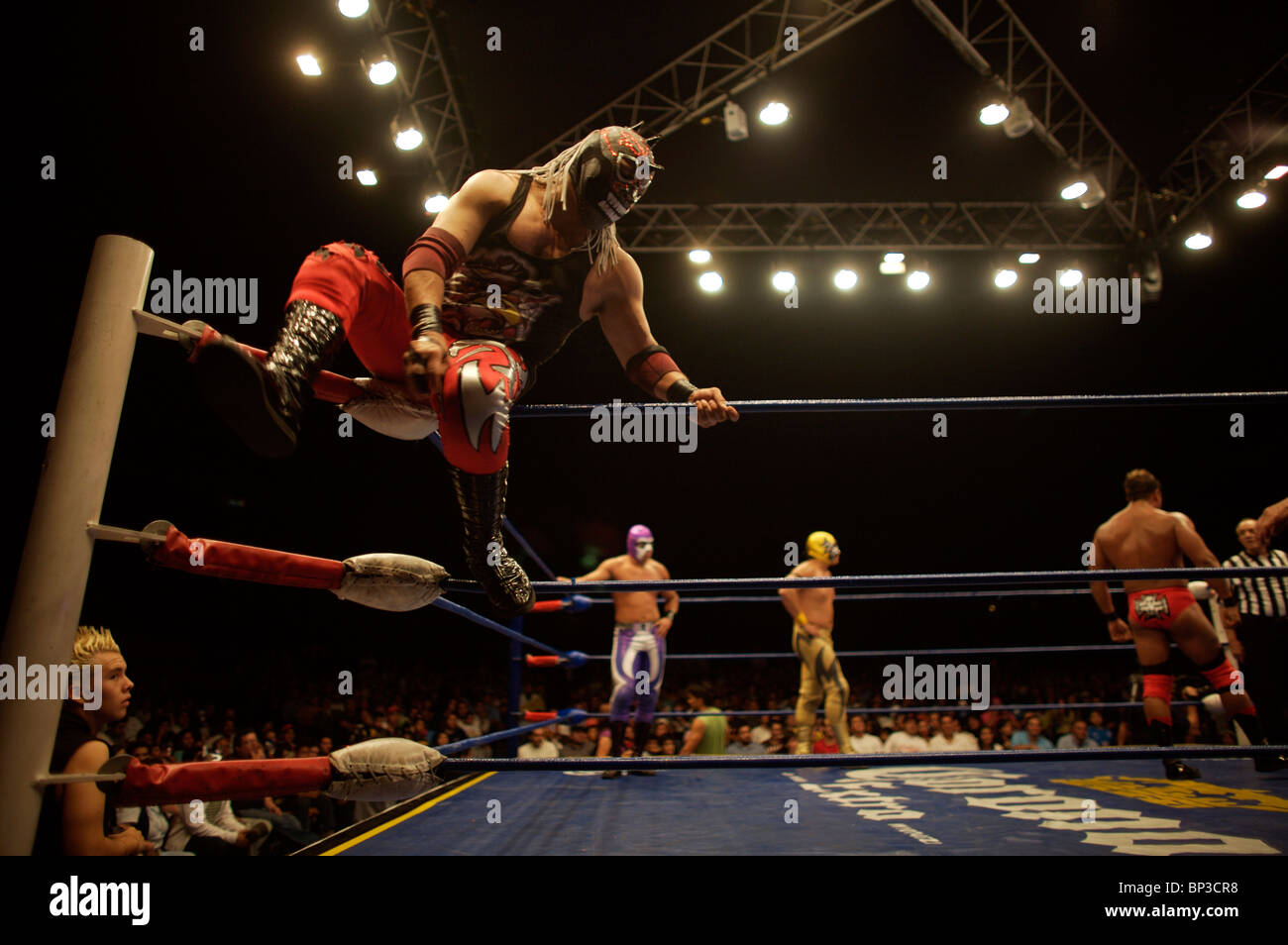 Masked wrestlers fight at a Lucha Libre Wrestling show in Arena Mexico